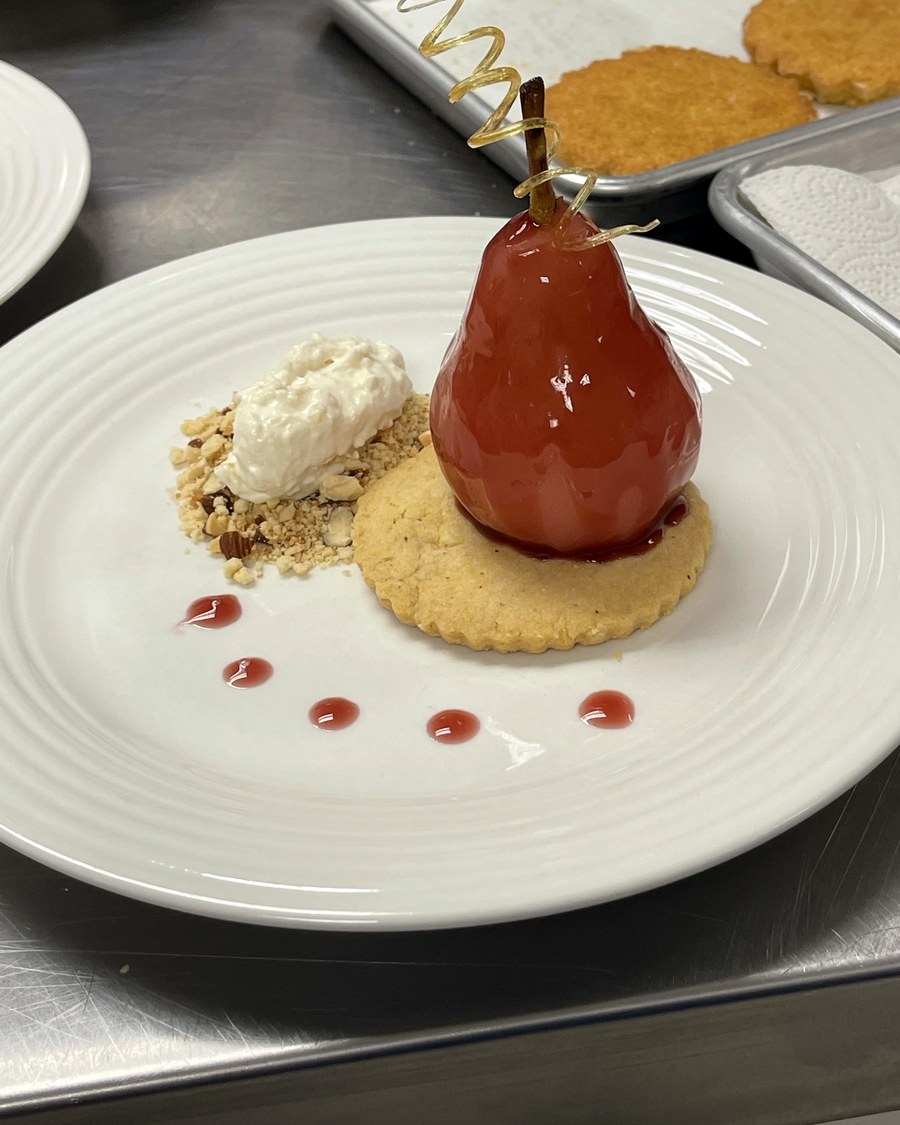 Plated dessert with poached pear
